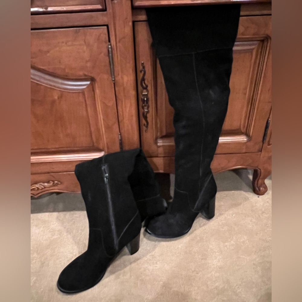 Black suede over-the-knee boots.